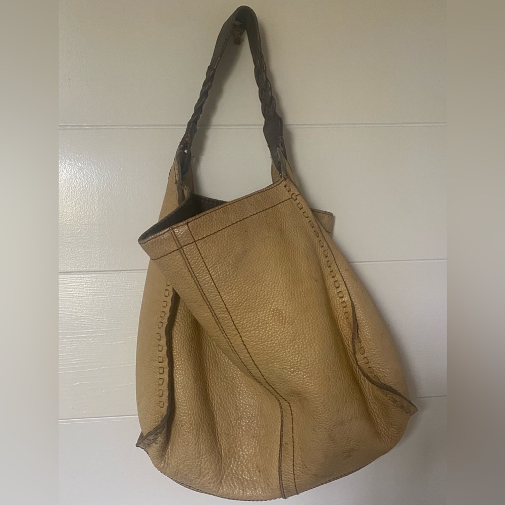 Lucky yellow purse worn